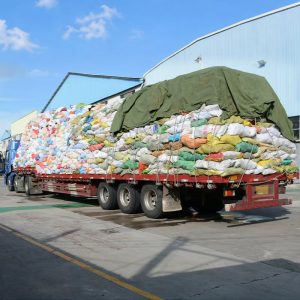 KingAAA incoming used clothing supply truck arriving at Guangzhou warehouse for incoming material inspection before sorting and grading.