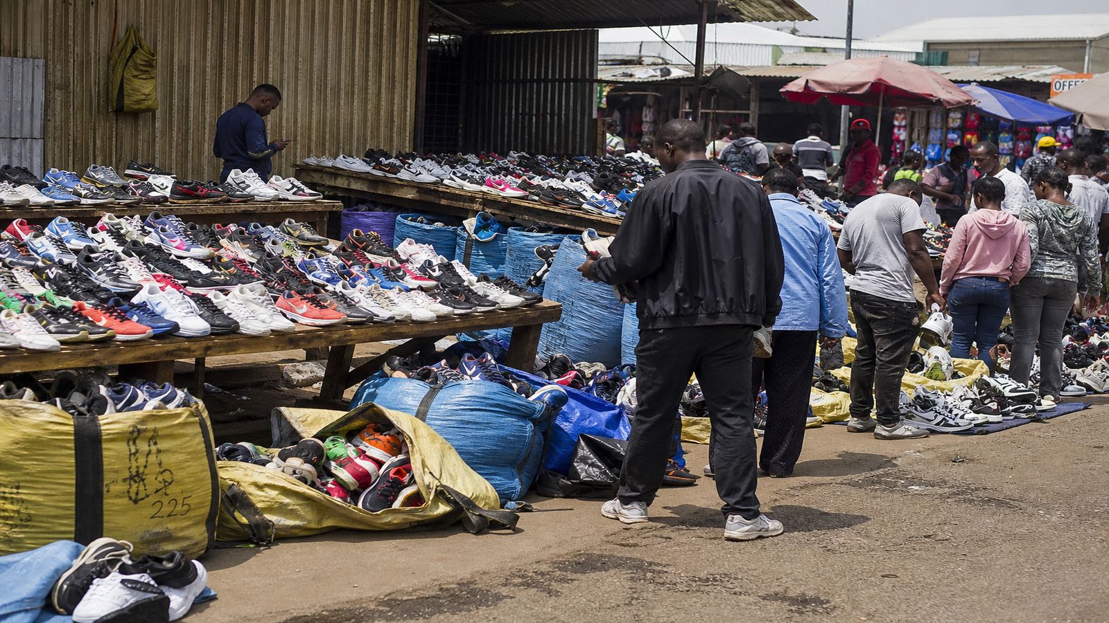 Authentic open-air second-hand sneaker market stall in South Africa with Grade A used sneakers wholesale from best used sneaker resellers in south africa