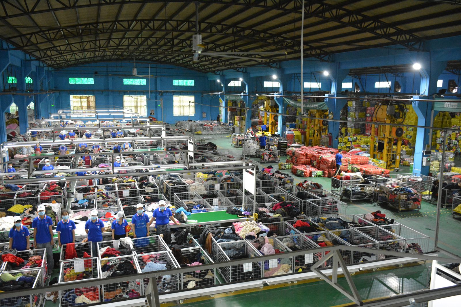 Authentic high-angle photograph of King AAA Guangzhou 20,000 sqm sorting floor illustrating why seeing the factory matters for used clothing importers
